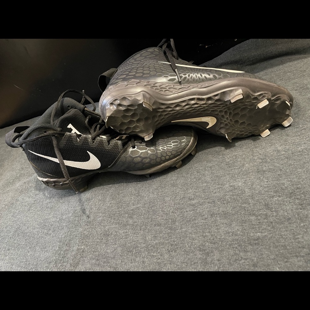 Metal baseball cleats.